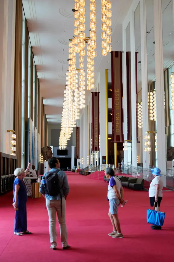 People are seen in the Grand Foyer at the Kennedy...