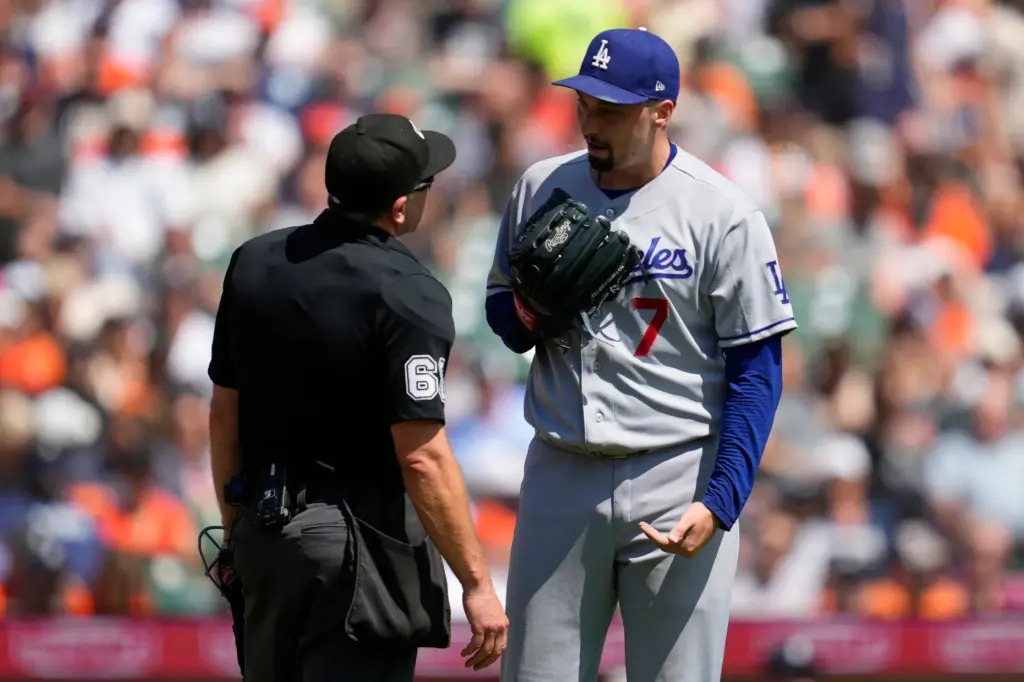 Dodgers pitcher Blake Snell (7) talks with home plate umpire...