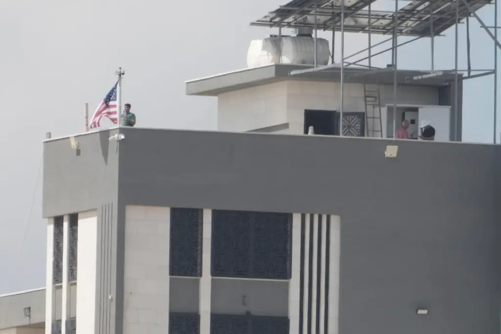 Loui Ridi raised the American flag on the roof of his house.