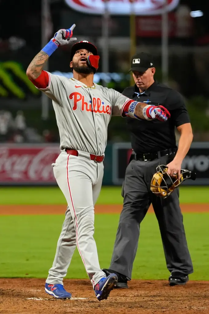 The Philadelphia Phillies’ Edmundo Sosa gestures as he crosses home...