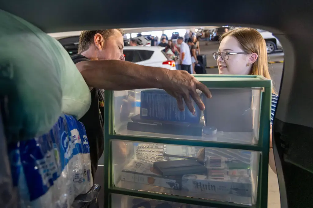 Tim OâConnell, on the left, and Emily OâConnell unload the...