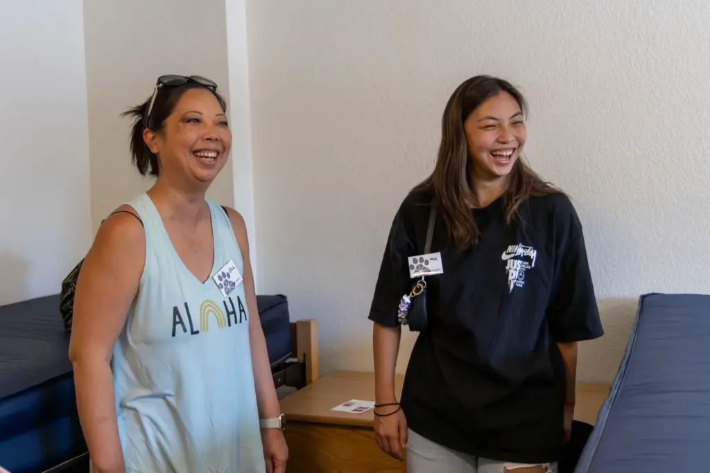 Jill Takayama, on the left, laughs with her daughter Mia...