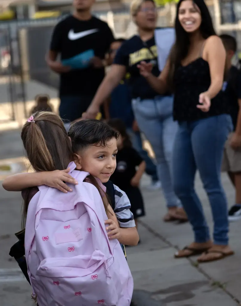 School friends Jared Perez and Emilia Pimentel, both 6, enthusiastically...