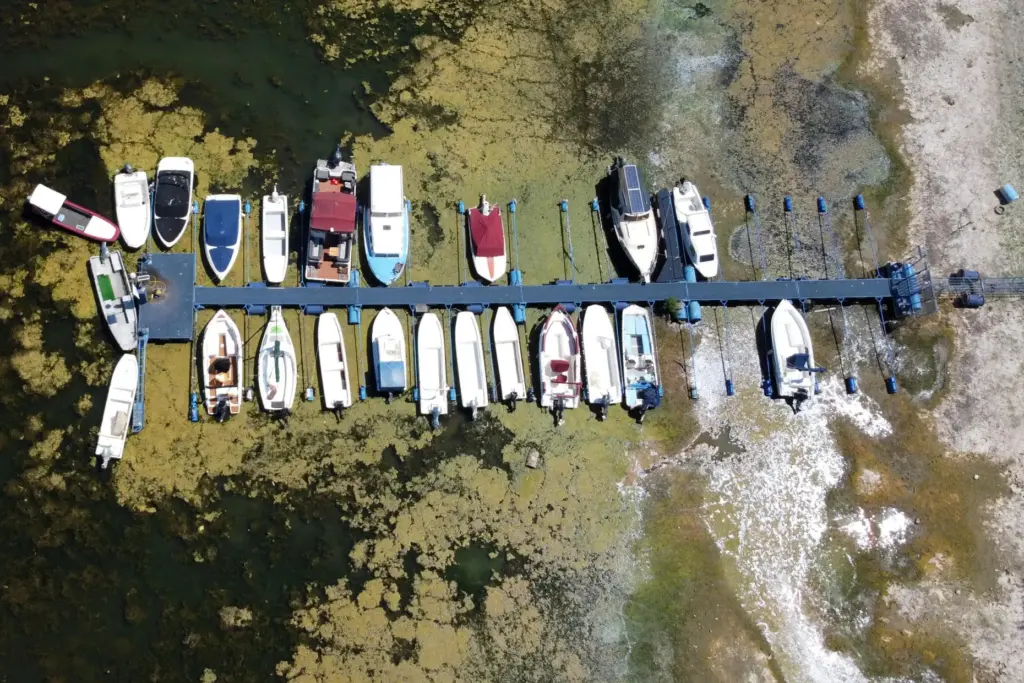 Boats sit on dry ground as water levels have dropped...
