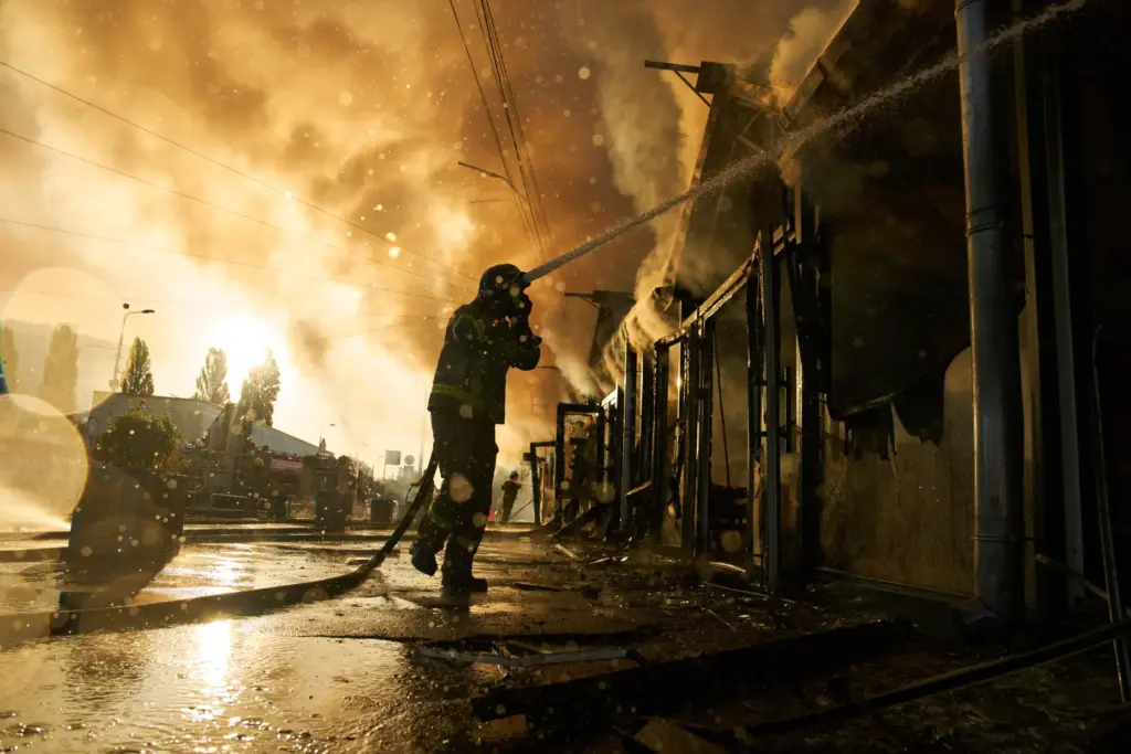 Firefighters try to put out a fire at a city...