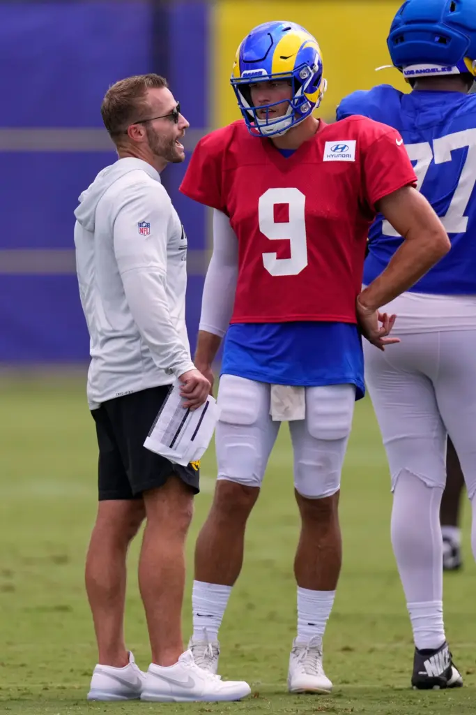 Rams head coach Sean McVay, left, talks with quarterback Matthew...