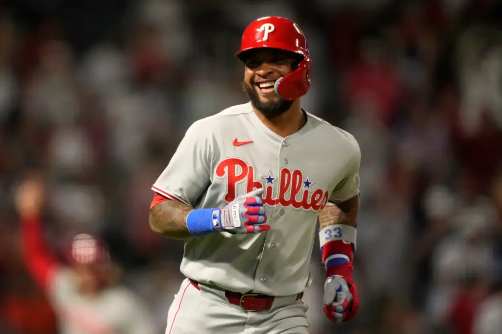 The Philadelphia Phillies’ Edmundo Sosa smiles toward his dugout after...