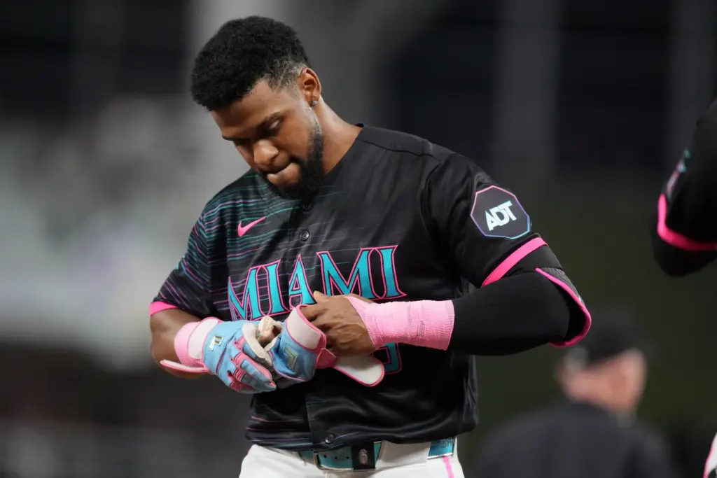 The Miami Marlins’ Otto Lopez reacts after grounding out with...
