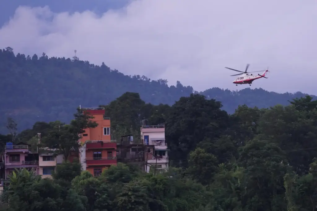 A government helicopter conducts a rescue mission amidst the devastation...