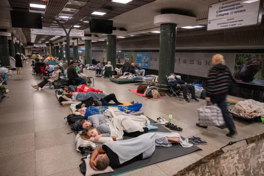 People take shelter in a metro station during a night Russian attack, in Kyiv, Ukraine.
