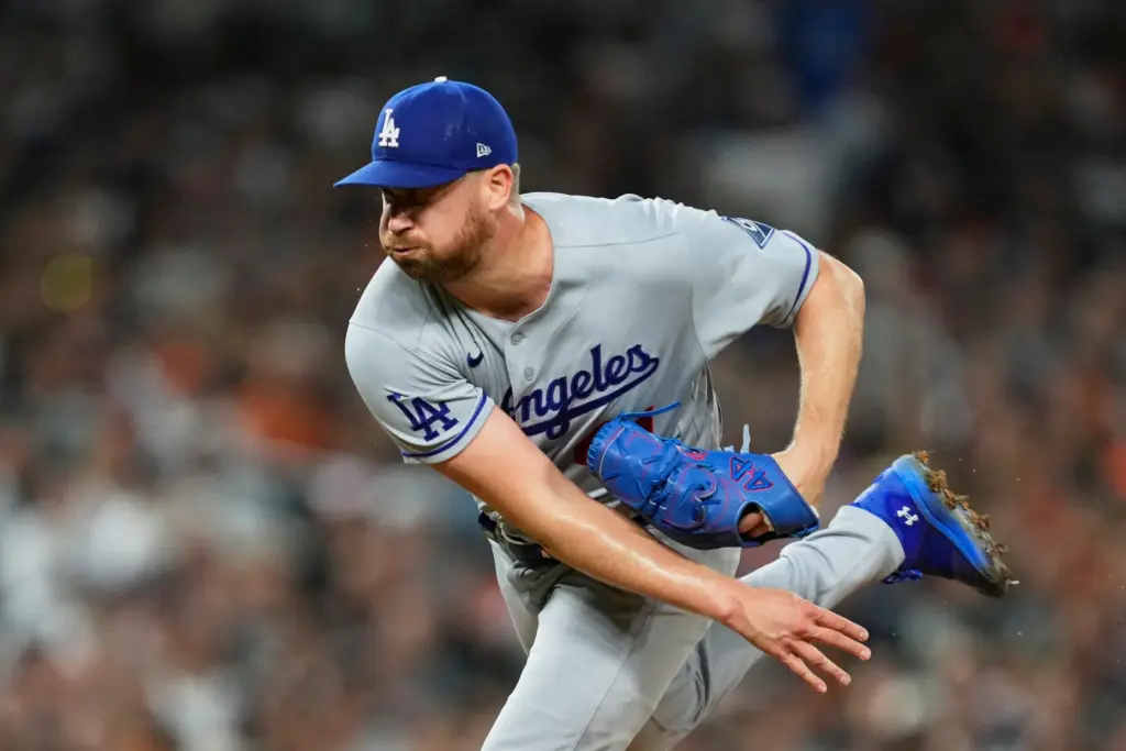 Dodgers relief pitcher Brock Stewart throws to the plate against...