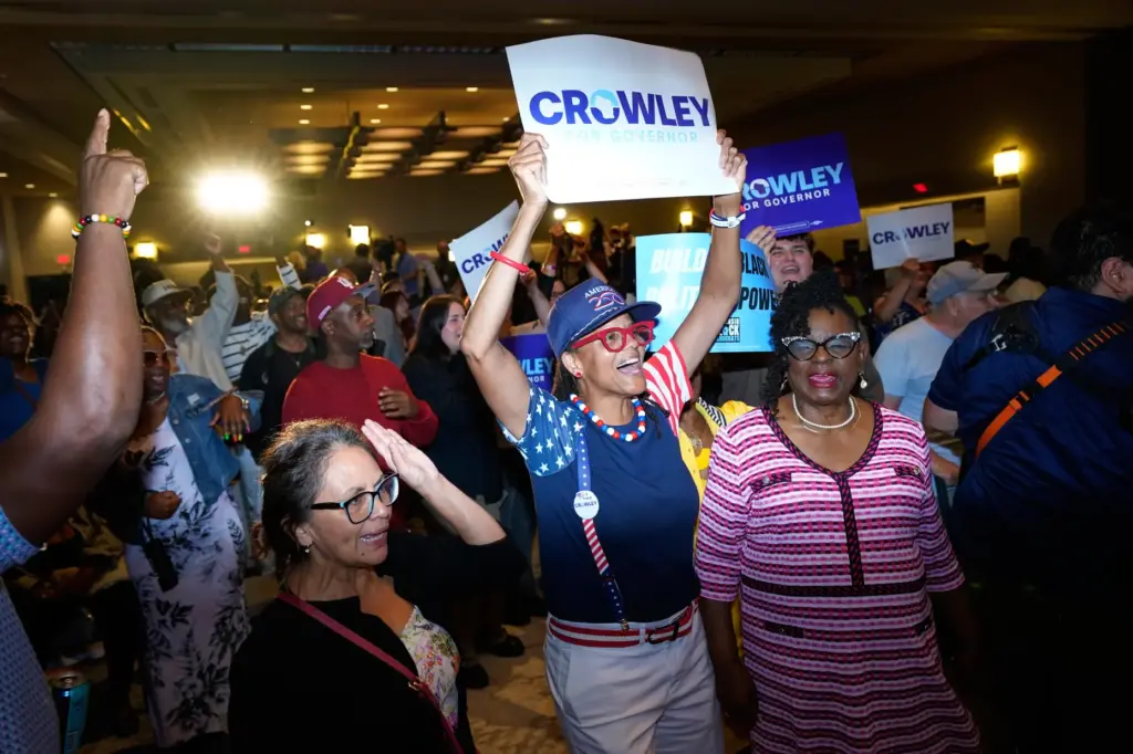Supporters react to election results coming in during a primary...