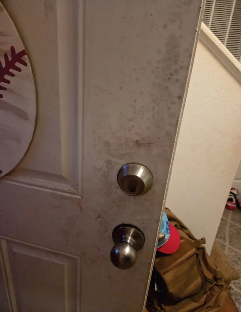 Visible mold growth is seen on an interior door in the Hawkinsâ Fort Eustis home.