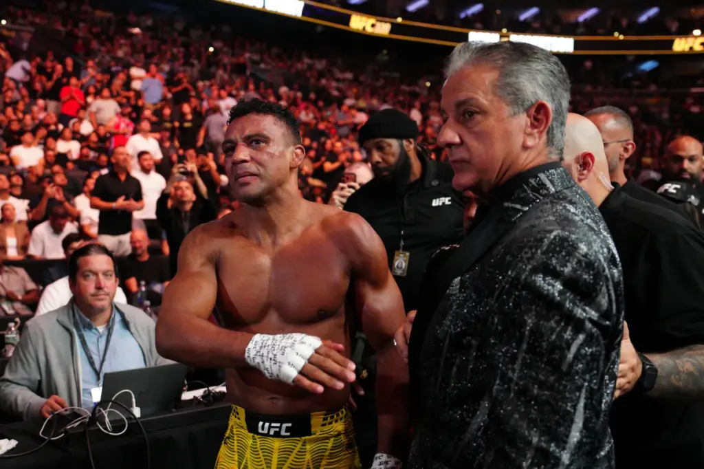 Edson Barboza, left, walks from the ring after a lightweight...