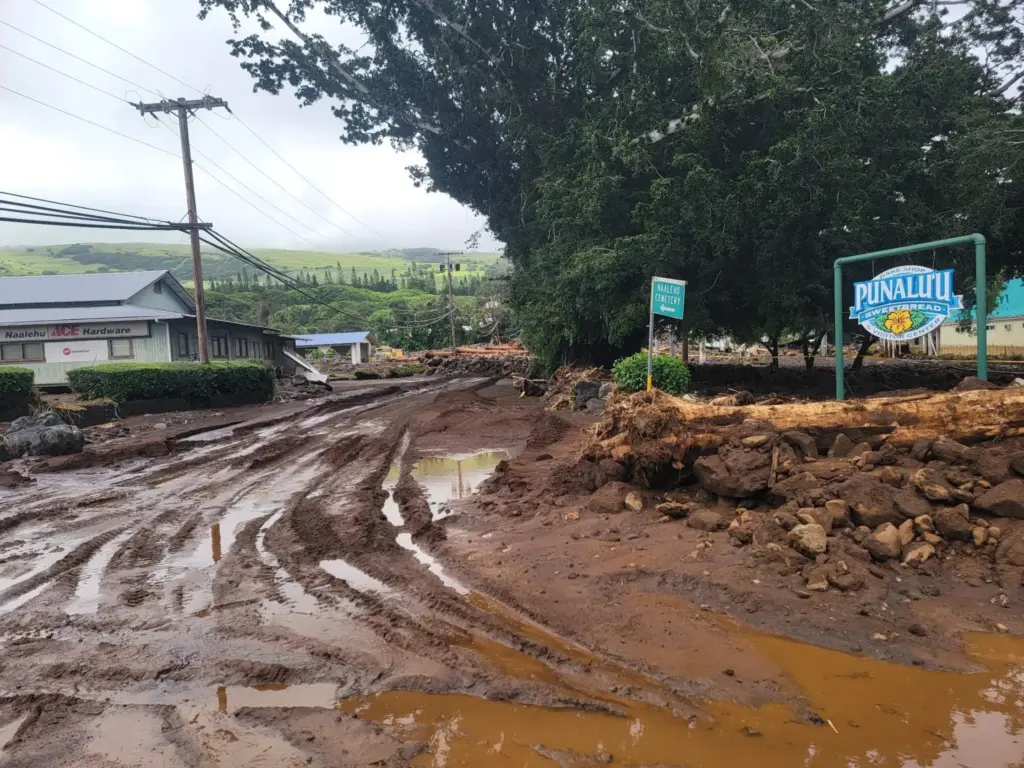 A roadway is washed out by mud on Monday, Aug....