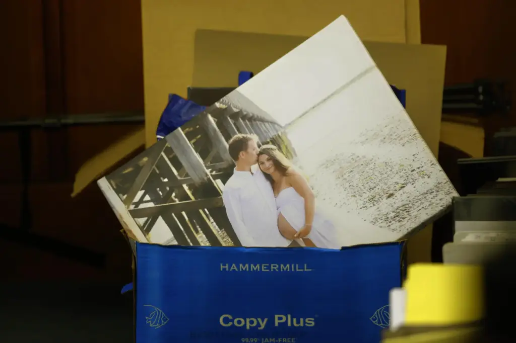 A wedding photo is seen in a bin of papers...