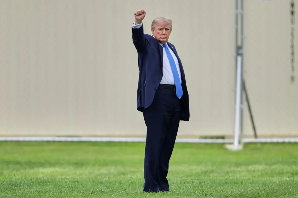 President Donald Trump gestures as he walks to board Marine One.