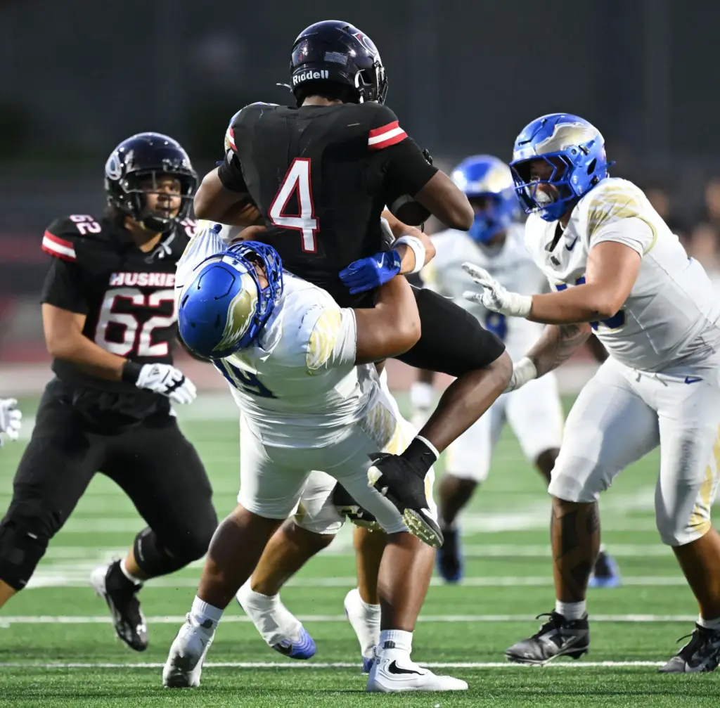 Santa Margarita defensive lineman Kingston Jimmerson (99) picks up a...