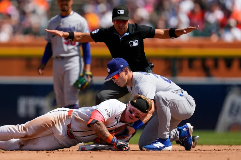 Detroit Tigers’ Max Clark slides safely into second base for...
