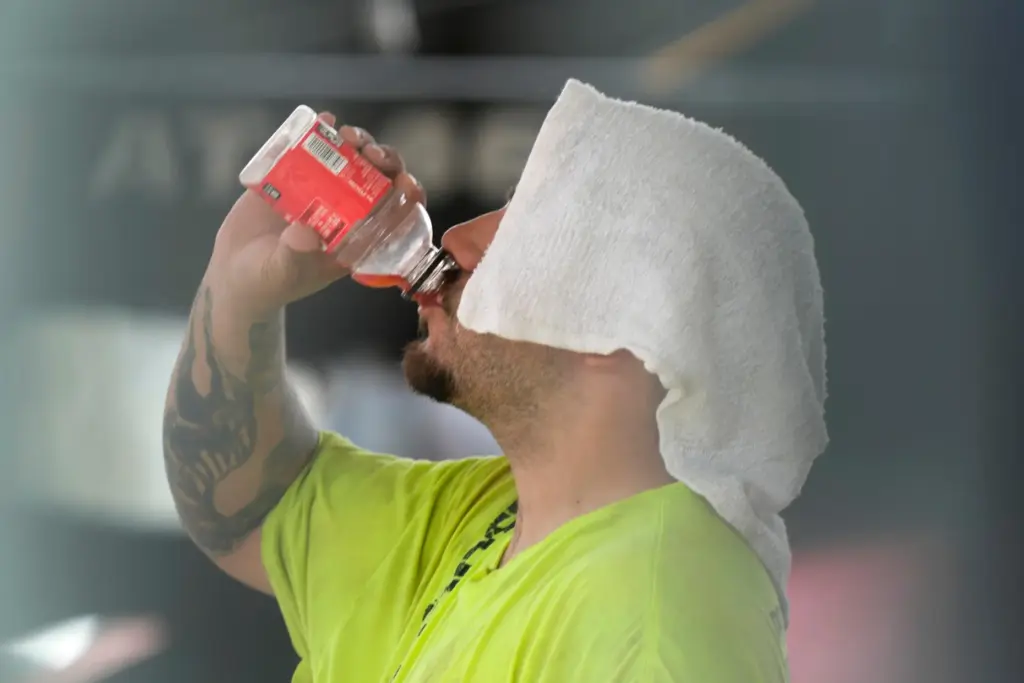 FILE – A construction worker hydrates at the Shedd Aquarium,...