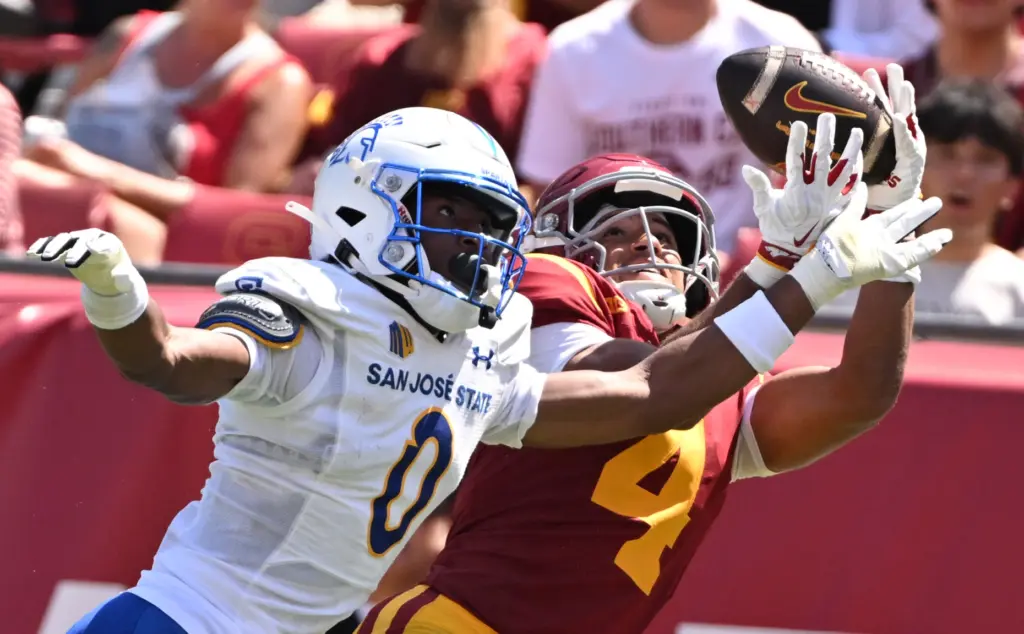 Wide receiver Trent Mosley (4) of the USC Trojans reaches...