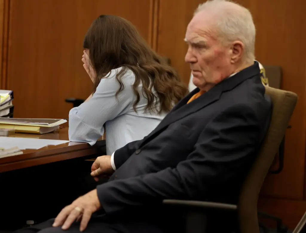 Defense attorney Kevin Reddington and Lindsay Clancy listen to the...