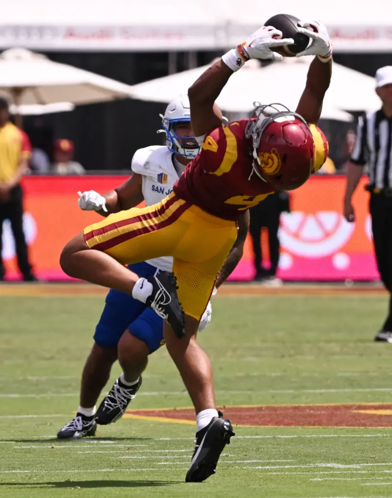 Wide receiver Trent Mosley (4) of the USC Trojans catches...