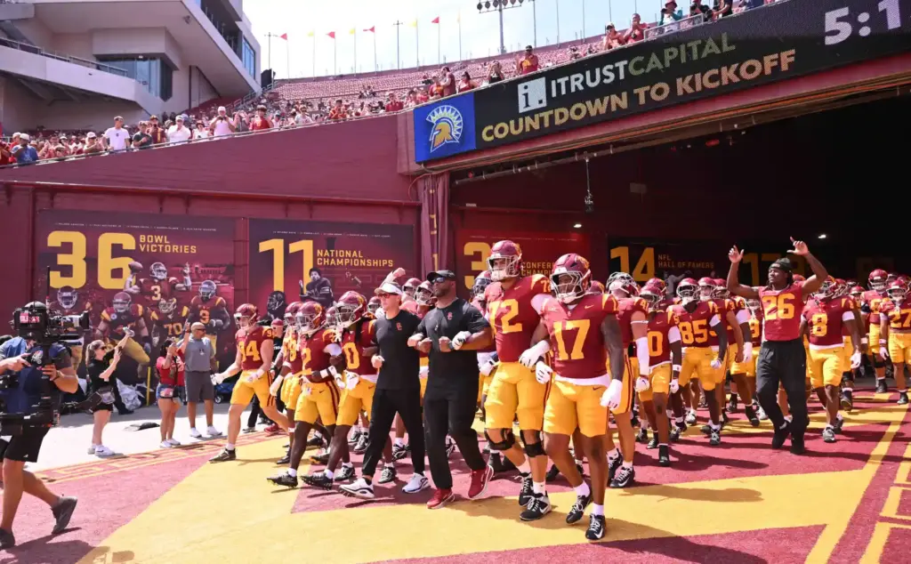 Head coach Lincoln Riley of the USC Trojans walks onto...