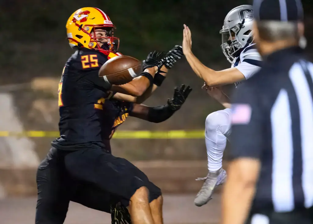 Mission Viejoâs Gavin Ploszaj, left, blocks a Chaparral punt that...