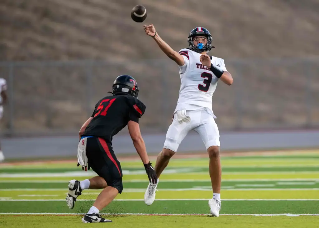Tustin quarterback Ayden Edwards (3) throws the ball during an...
