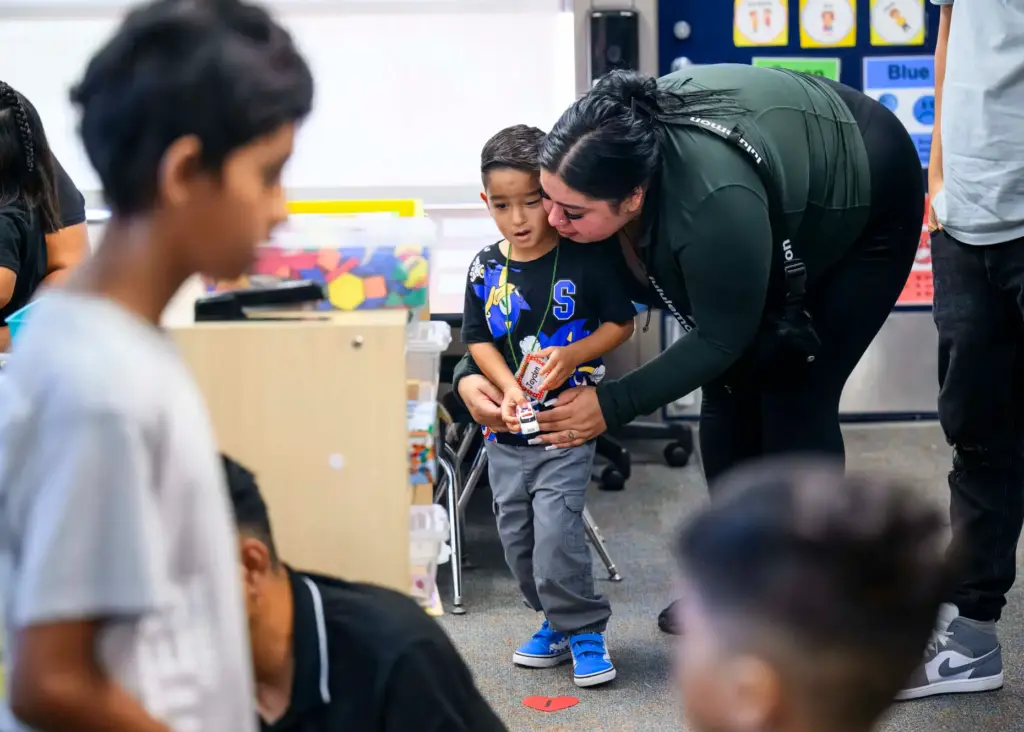 Julissa Zamarripa gives her son Jayden, 4, a hug before...
