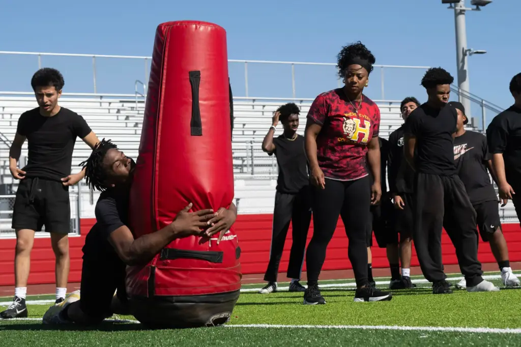 Head Coach Jazmin Gamble, right, leads practice at Hawthorne High...
