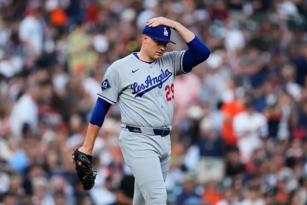 Dodgers pitcher Tarik Skubal walks back to the mound after...