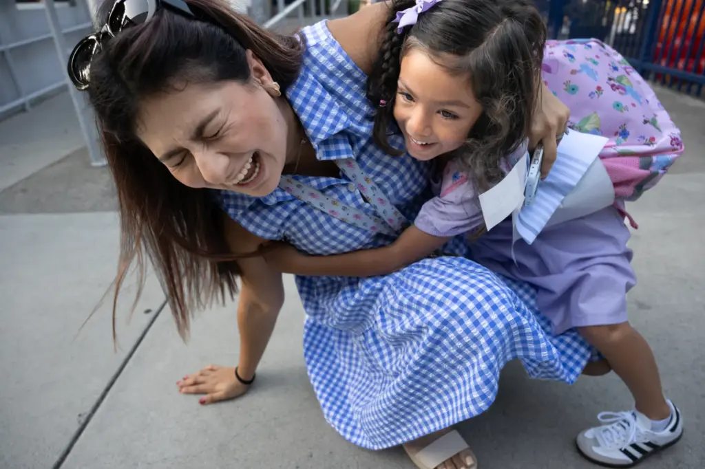Dual Language Academy TK teacher Anna Ambriz loses balance while...