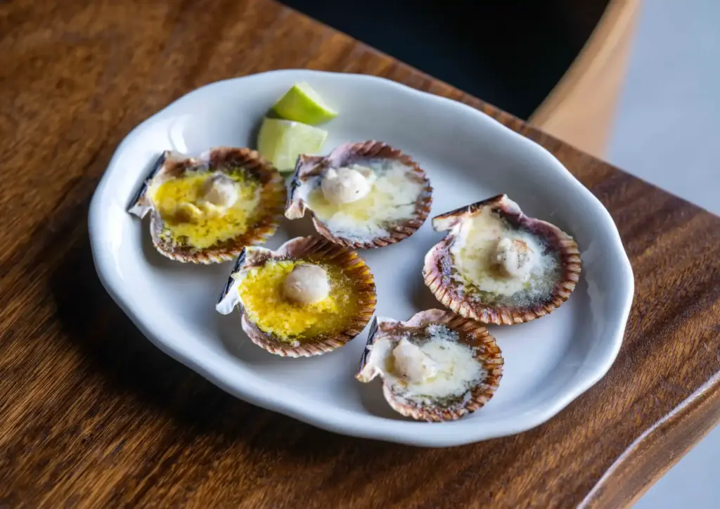 Rocoto Pesca Barâs parmesan scallops offer a French-Peruvian take on...