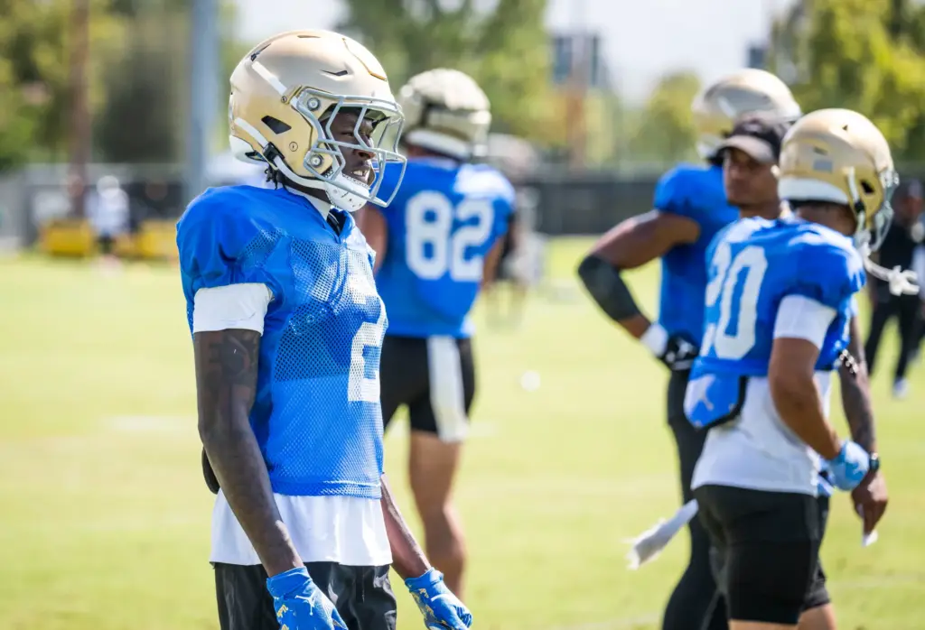 UCLA wide receiver Brian Rowe Jr. goes through drills during...
