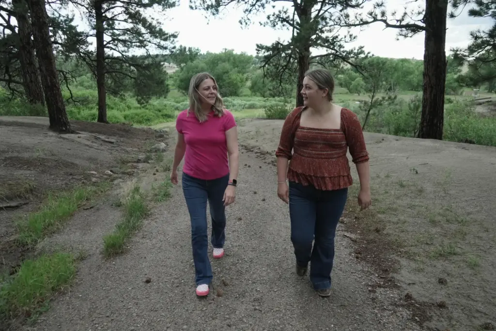 Anne Schultz and her daughter, Charlotte Touzalin, go on a...