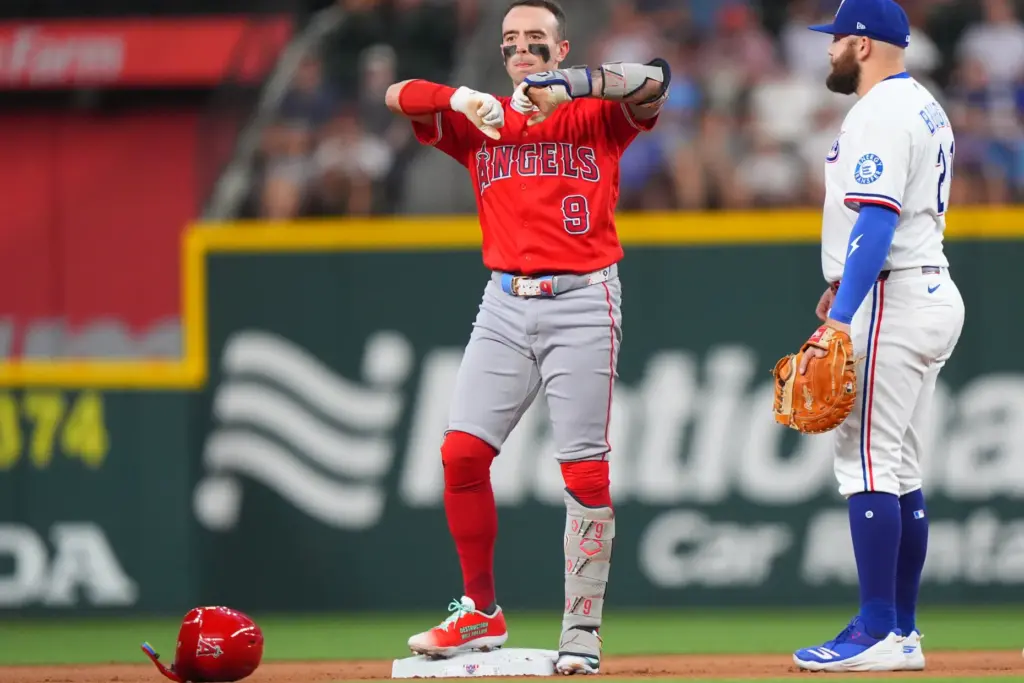 Angels’ Zach Neto (9) reacts from second base next to...