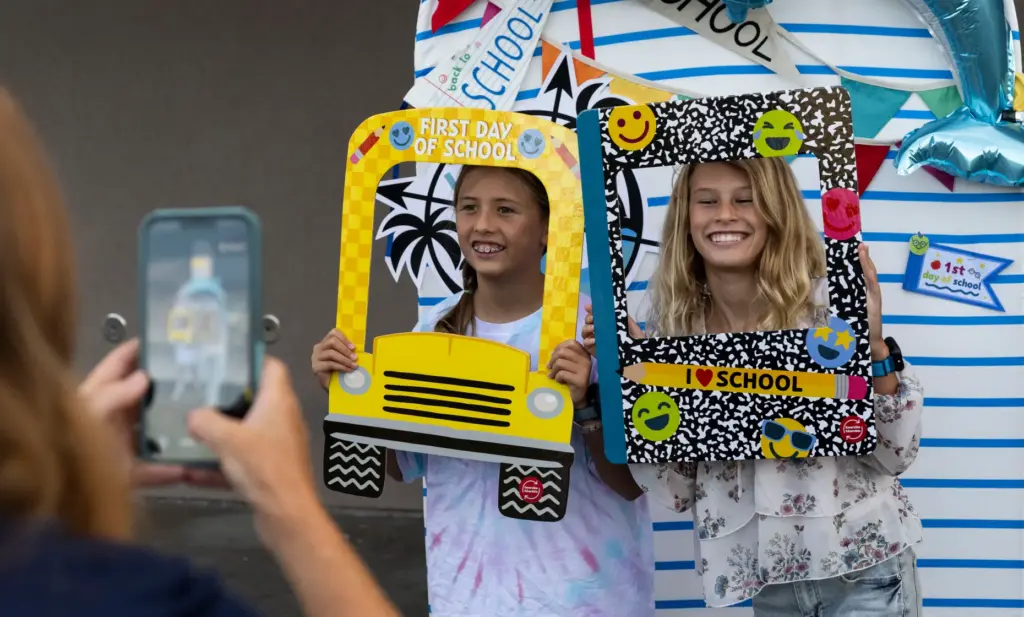 Leia Lee, left and Everly Nicol take a photo during...