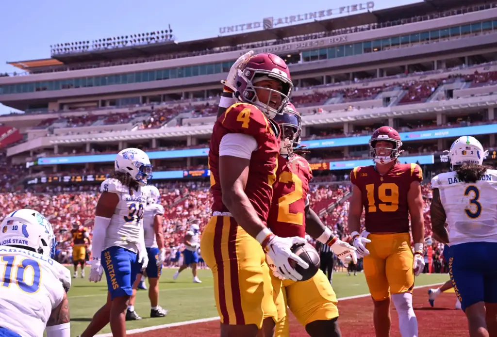 USC wide receiver Trent Mosley (4) reacts after scoring a...