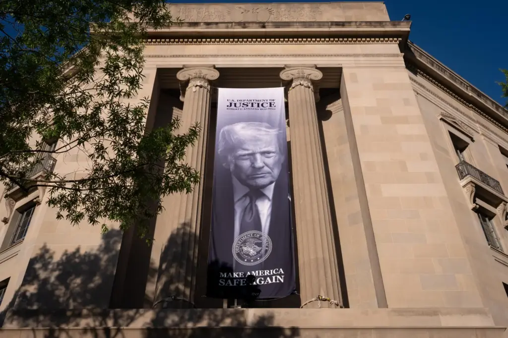 A portrait of President Donald Trump is displayed at the Justice Department building.