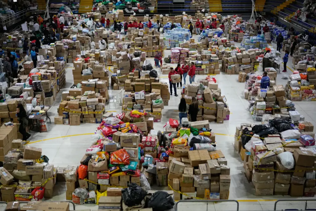 Volunteers sort aid bound for people affected by the earthquake...