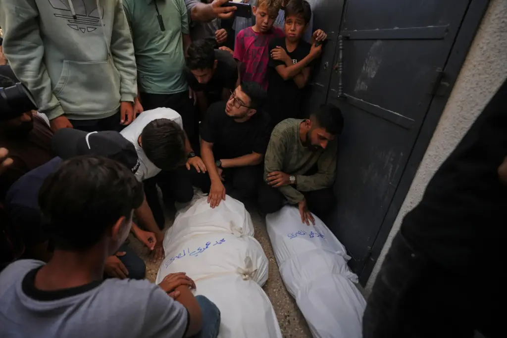 Mourners attend the funeral of Palestinians who were killed in an Israeli army strike.