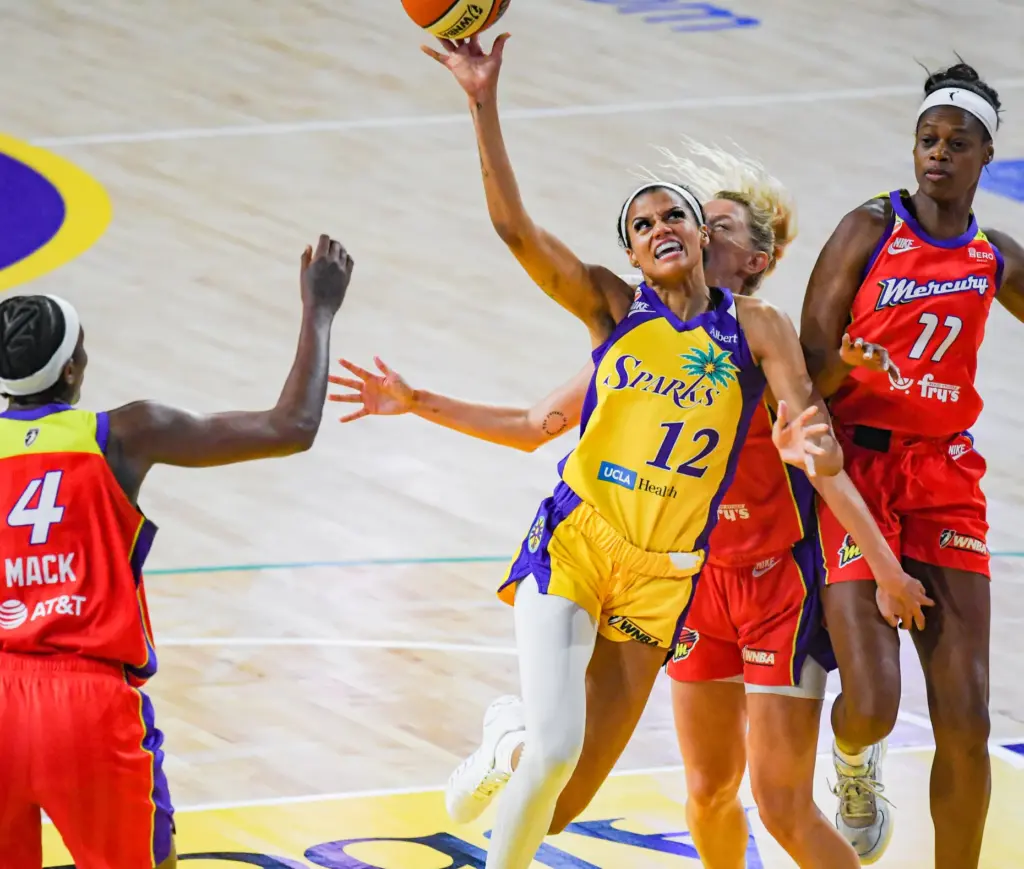 Los Angeles Sparks guard Rae Burrell drives toward the basket...