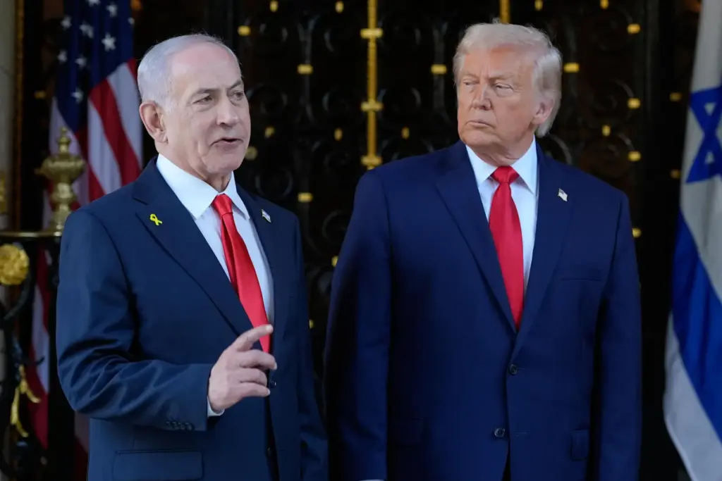President Donald Trump listens as Israel's Prime Minister Benjamin Netanyahu speaks.