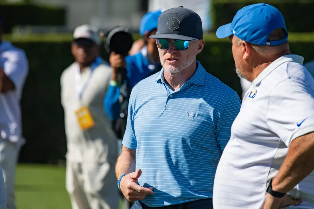 Former Buffalo Bills coach Sean McDermott chats while watching the...