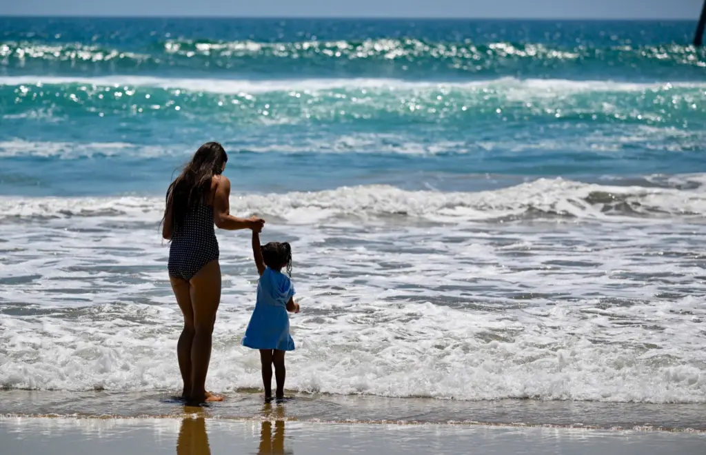 Chloe Castillo plays with her daughter, Carmen Castillo, in the...