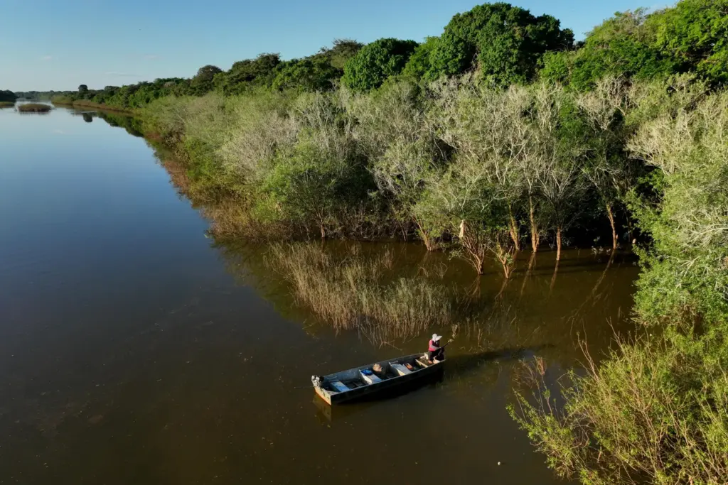 A woman from the Java Indigenous group fishes in the Javae River in Brazil.