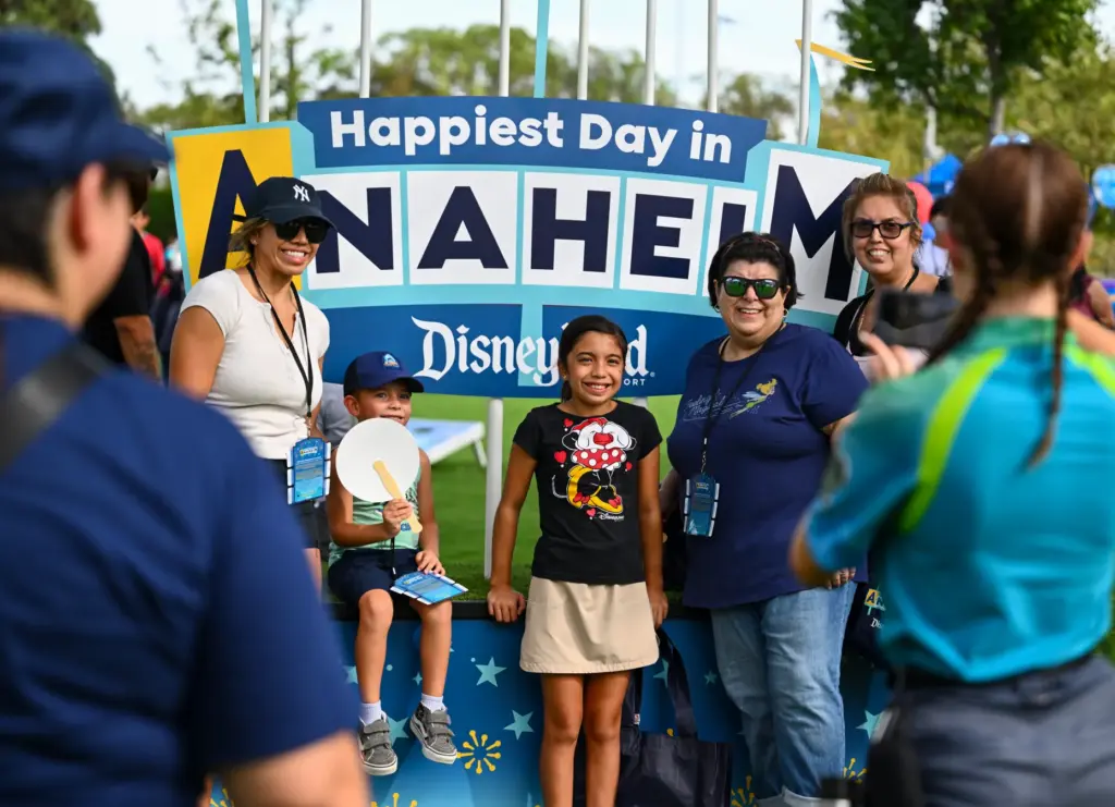 Visitors take a picture during Disneyâs âHappiest Day in Anaheimâ...