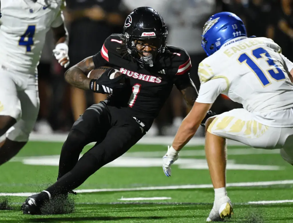 Centennial wide receiver Quentin Hale (1) makes the first down...